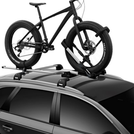 http://Bicycle%20on%20a%20rack%20installed%20on%20top%20of%20a%20vehicle.
